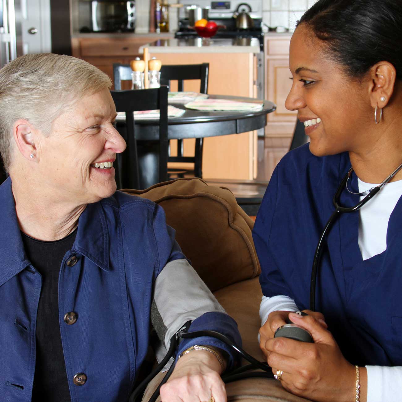Caregiver checking wellness and safety at home