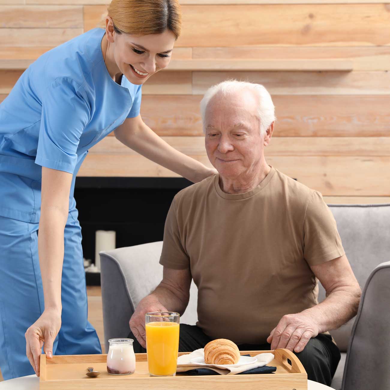 Caregiver helping with meal preparation at home